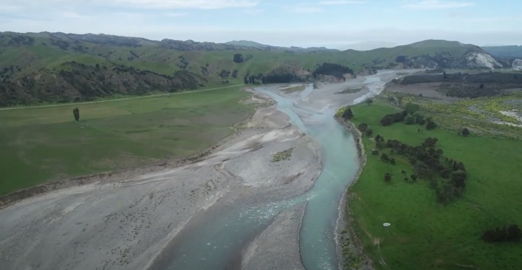 An aerial photo showing a river merging.