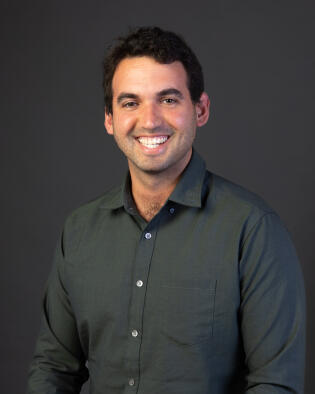 Man smiling at the camera.