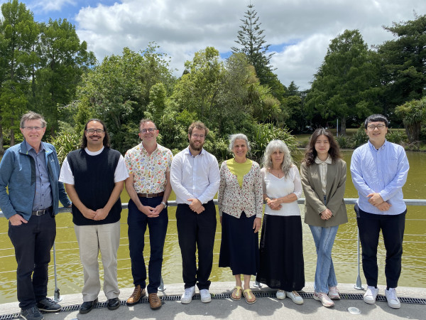 Photo of eight people from University of Waikato, all smiling.