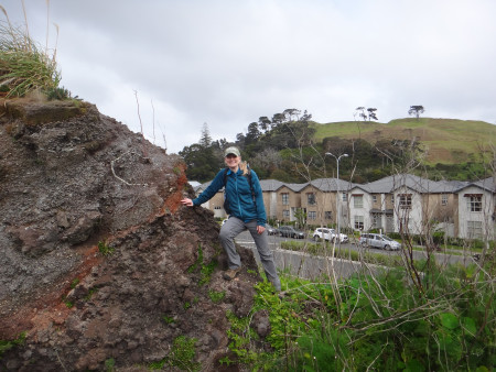Researcher Elaine Smid poses next to rock formation