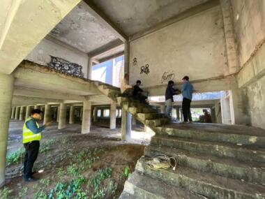 Engineers inspecting a building in a demolition site.