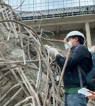 Man works at a demolition site.