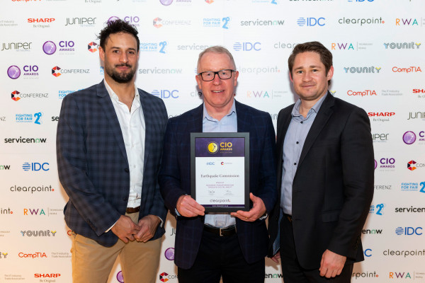 J Lindsay, S Miller, and J Shaw stand with a certificate